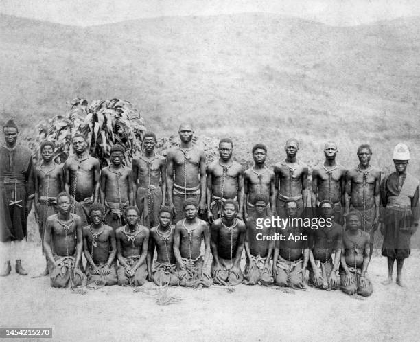 In Belgian Congo, circa 1900, a group of prisoners kept by locals for Belgian colonizers who ran the country. Offences were mainly theft and the...