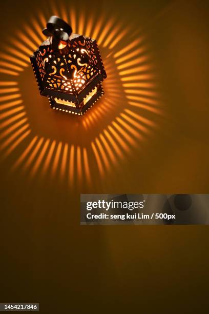 arabic lantern with light rays greeting card for muslim community holy month ramadan kareem,malaysia - muslims celebrate the holy month of ramadan stock pictures, royalty-free photos & images