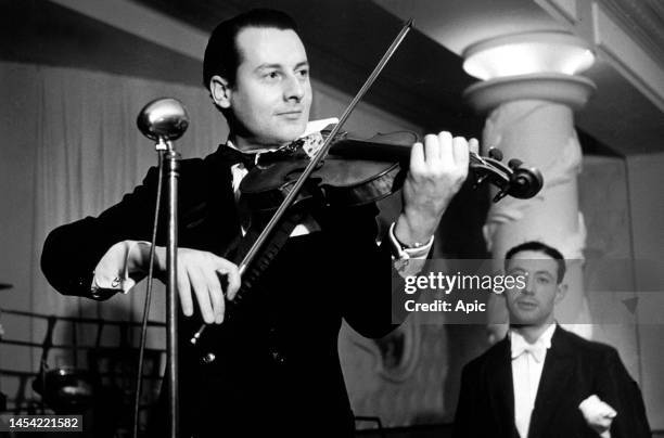 Stephane Grappelli playing violin on stage circa 1937.