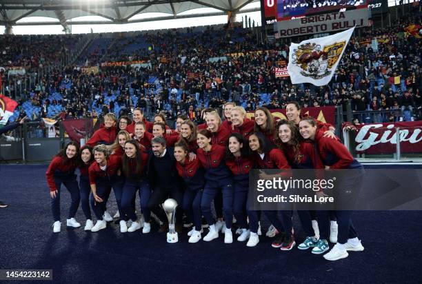 Roma woman players celebrates with the SuperCup Trophy under Curva Sud before the Serie A match between AS Roma and Bologna FC at Stadio Olimpico on...