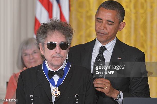 President Barack Obama presents the Presidential Medal of Freedom to musician Bob Dylan during a ceremony on May 29, 2012 in the East Room of the...