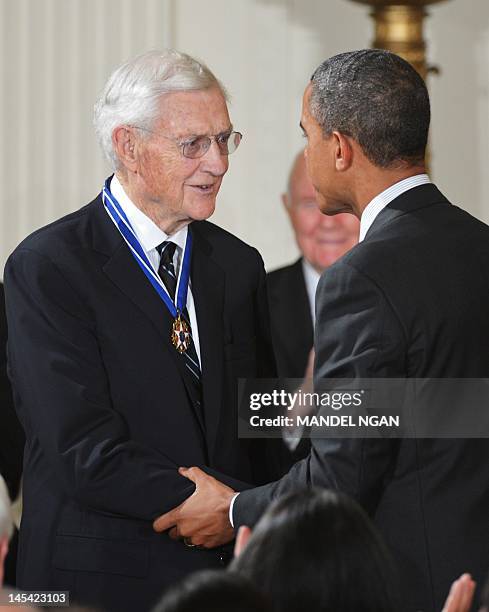 President Barack Obama congratulates former assistant attorney general in charge of the Civil Rights Division of the Department of Justice John Doar...