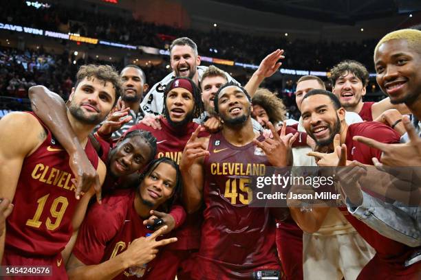 Donovan Mitchell of the Cleveland Cavaliers celebrates with teammates after he scored a Cavaliers franchise record 71 points in an overtime defeat of...