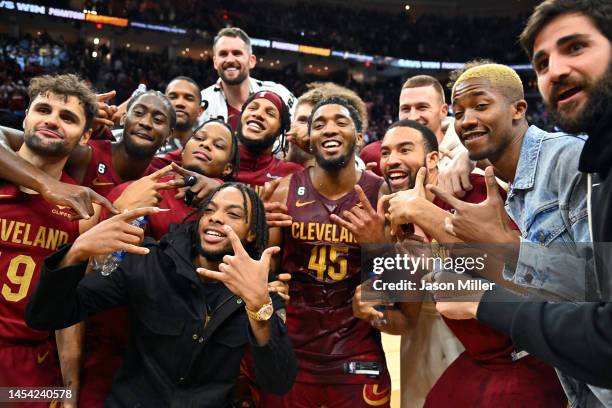 Donovan Mitchell of the Cleveland Cavaliers celebrates with teammates after he scored a Cavaliers franchise record 71 points in an overtime defeat of...