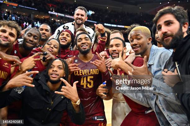 Donovan Mitchell of the Cleveland Cavaliers celebrates with teammates after he scored a Cavaliers franchise record 71 points in an overtime defeat of...