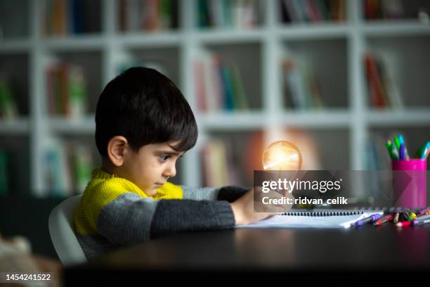 adorable little boy, drawing picture - desk lamp stock pictures, royalty-free photos & images