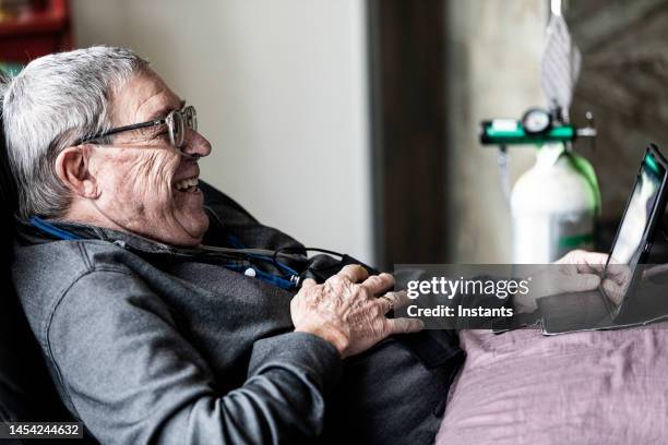 entertained senior man! - medical oxygen equipment stock pictures, royalty-free photos & images