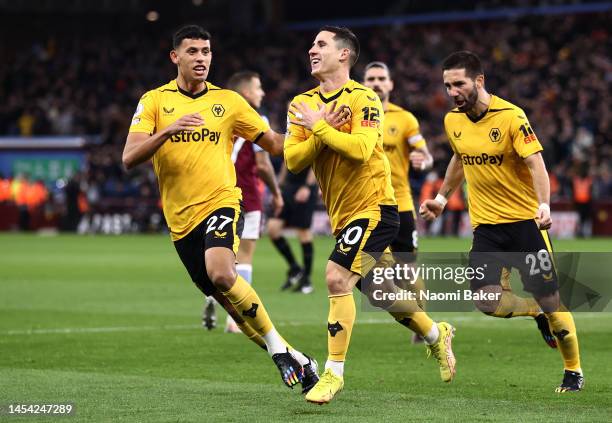 Daniel Podence of Wolverhampton Wanderers celebrates with teammates after scoring the team's first goal during the Premier League match between Aston...