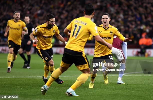 Daniel Podence of Wolverhampton Wanderers celebrates after scoring the team's first goal during the Premier League match between Aston Villa and...