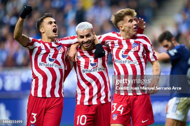 Pablo Barrios of Club Atletico de Madrid celebrates with his teammates Angel Correa and Sergio Reguilon of Club Atletico de Madrid after scoring his...