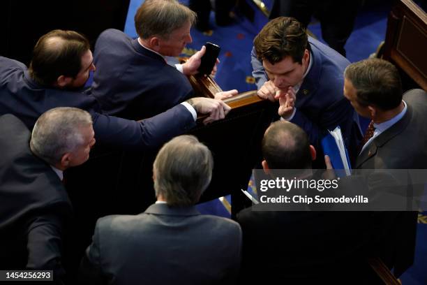 Rep.-elect Matt Gaetz talks to fellow members-elect in the House Chambers during the second day of elections for Speaker of the House at the U.S....