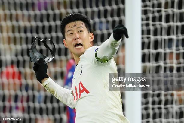 Son Heung-Min of Tottenham Hotspur celebrates with their mask after scoring the team's fourth goal during the Premier League match between Crystal...