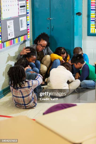 teacher and children doing school safety drill, lockdown - shutdown stock pictures, royalty-free photos & images