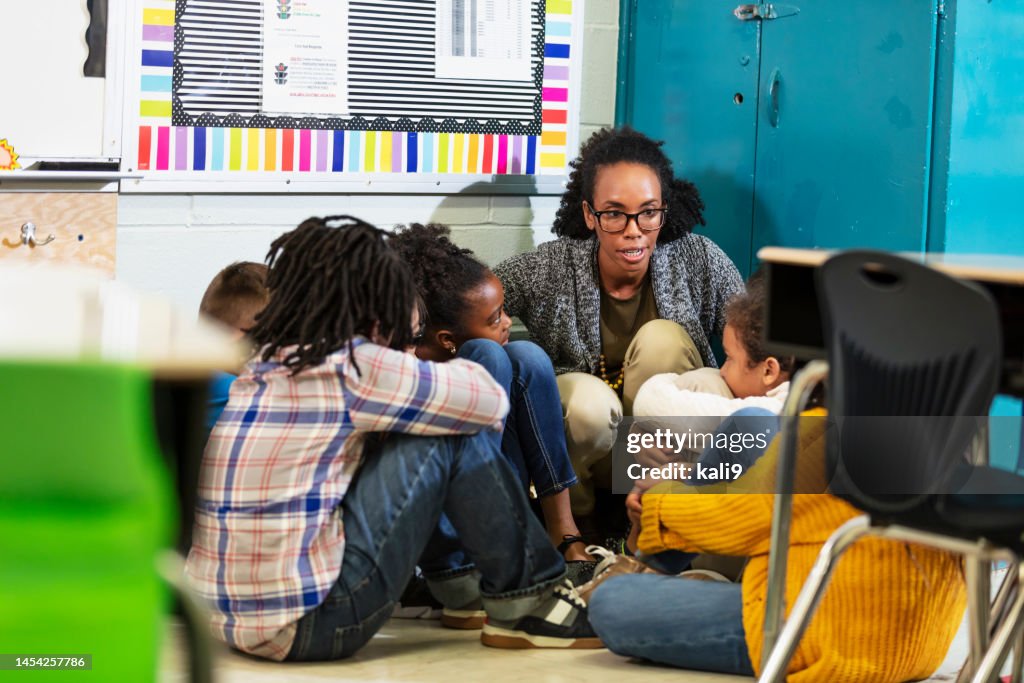 Teacher and children doing school safety drill, lockdown