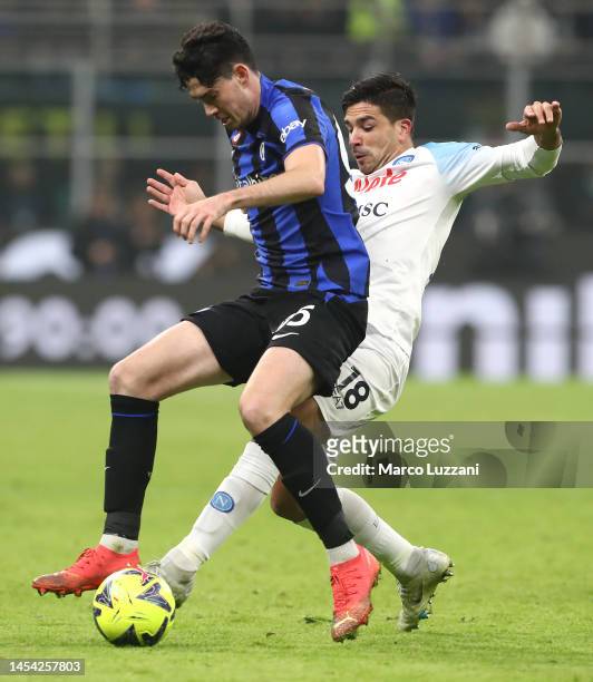 Alessandro Bastoni of FC Internazionale is challenged by Giovanni Simeone of SSC Napoli during the Serie A match between FC Internazionale and SSC...