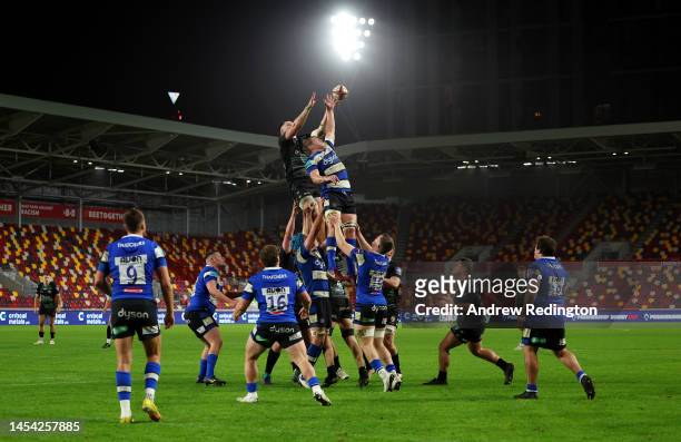 Ed Scragg of London Irish and Tom Ellis of Bath compete in the lineout during the Premiership Rugby Cup match between London Irish and Bath Rugby at...