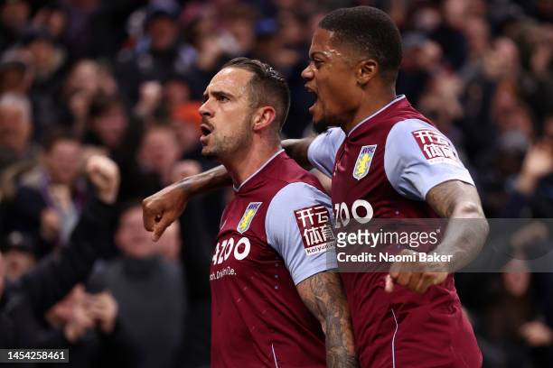 Danny Ings of Aston Villa celebrates with teammate Leon Bailey after scoring the team's first goal during the Premier League match between Aston...