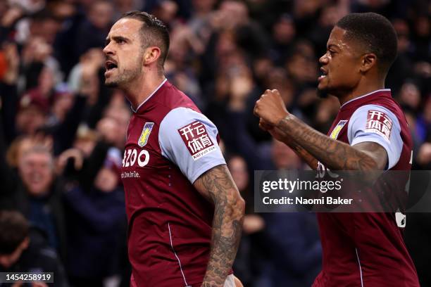 Danny Ings of Aston Villa celebrates with teammate Leon Bailey after scoring the team's first goal during the Premier League match between Aston...