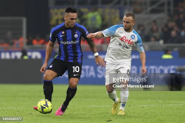 Lautaro Martinez of FC Internazionale is challenged by Stanislav Lobotka of SSC Napoli during the Serie A match between FC Internazionale and SSC...