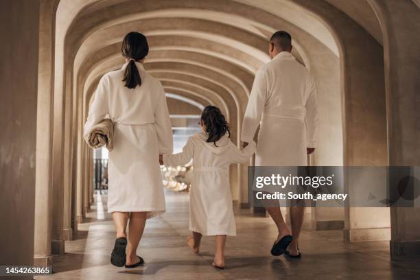 family in luxury hotel - bathrobe 個照片及圖片檔