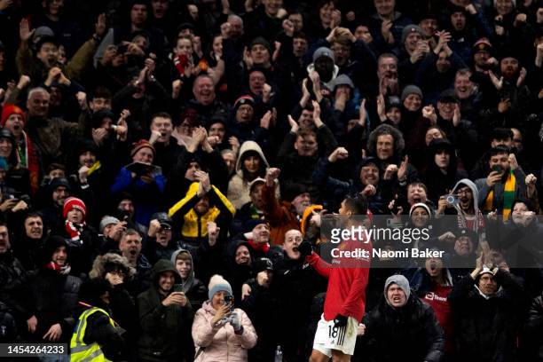 Casemiro of Manchester United celebrates to the fans after scoring his sides first goal during the Premier League match between Manchester United and...