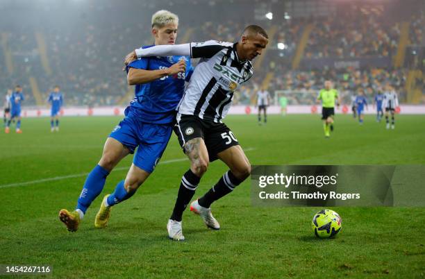 Rodrigo Becao of Udinese Calcio holds off Martin Satriano of Empoli FC during the Serie A match between Udinese Calcio and Empoli FC at the Dacia...