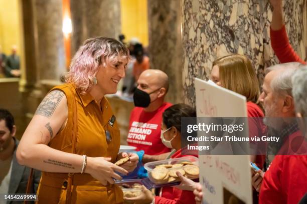 Rep. Leigh Finke, DFL-St. Paul grabbed a cookie from members of Moms Demand Action outside the Minnesota Legislature Senate Chamber Tuesday, Jan. 3,...