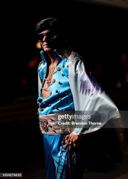 An Elvis impersonator walks on Central Station platform prior to boarding the Elvis Express on January 05, 2023 in Sydney, Australia. The Parkes...