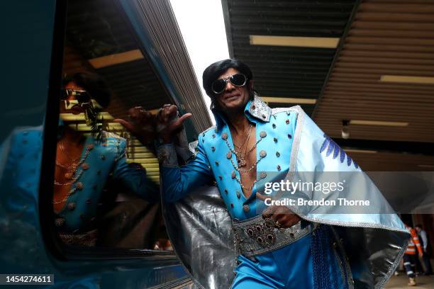 An Elvis impersonator walks on Central Station platform prior to boarding the Elvis Express on January 05, 2023 in Sydney, Australia. The Parkes...