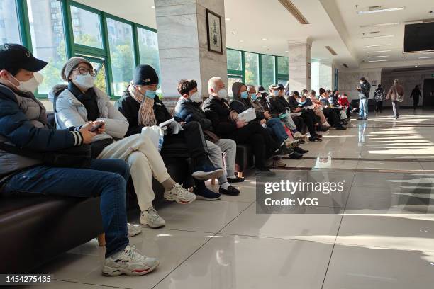 People wait for funeral service for their deceased relatives at Baoxing Funeral Parlor on January 4, 2023 in Shanghai, China.