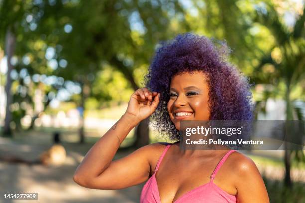 portrait of woman with purple hair at brazilian carnaval - purple hair stock pictures, royalty-free photos & images