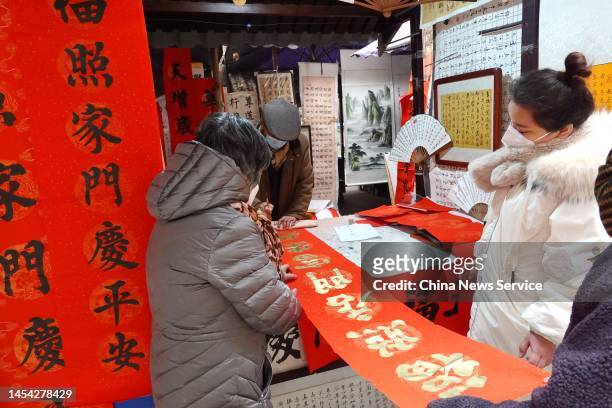 People purchase spring festival couplets as Chinese Spring Festival approaches on January 4, 2023 in Xi'an, Shaanxi Province of China.