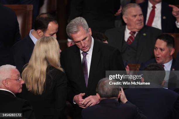 House Republican leader Kevin McCarthy talks with fellow Republicans in the House Chamber following a day of votes for the new Speaker of the House...