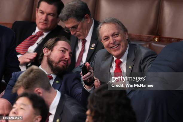 Rep.-elect Eli Crane and Rep. Andy Biggs and other members of the House Freedom Caucus, wait for the results of a vote to adjourn following a day of...