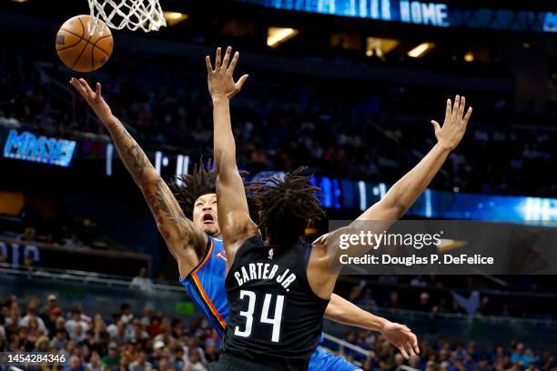 Jaylin Williams of the Oklahoma City Thunder drives to the net against the Orlando Magic during the first quarter at Amway Center on January 04, 2023...