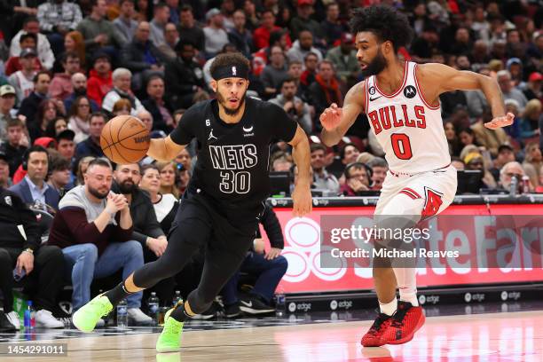 Seth Curry of the Brooklyn Nets drives to the basket against Coby White of the Chicago Bulls during the first half at United Center on January 04,...