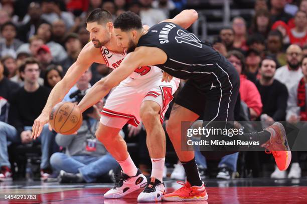 Ben Simmons of the Brooklyn Nets steals the ball from Nikola Vucevic of the Chicago Bulls during the first half at United Center on January 04, 2023...