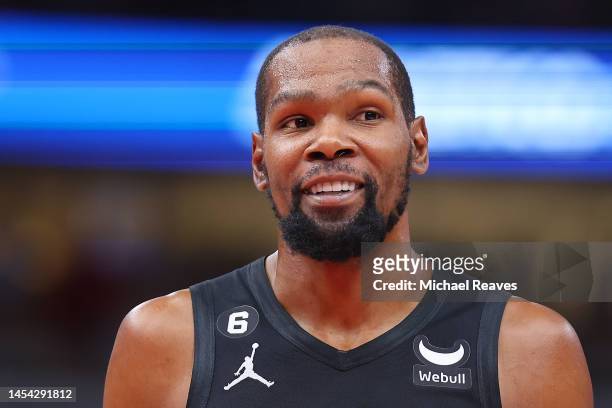 Kevin Durant of the Brooklyn Nets looks on against the Chicago Bulls during the first half at United Center on January 04, 2023 in Chicago, Illinois....