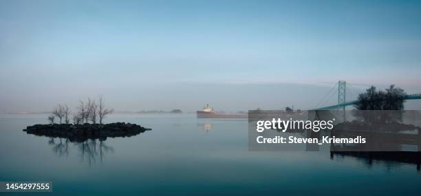 ambassador bridge - ship in fog - great lakes freighter stock pictures, royalty-free photos & images