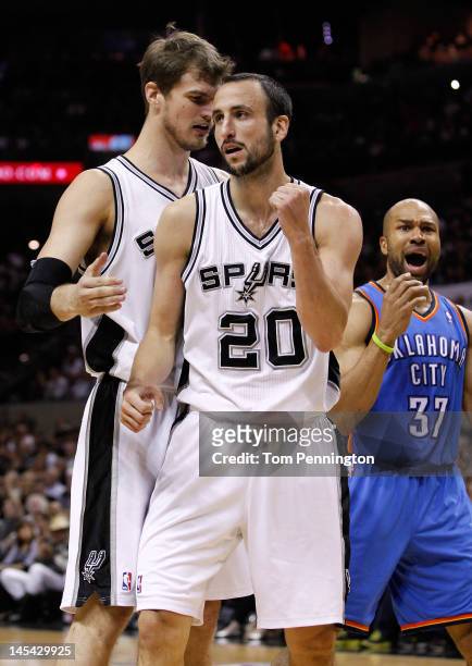 Manu Ginobili of the San Antonio Spurs reacts in the first half alongside Derek Fisher of the Oklahoma City Thunder in the second quarter in Game Two...