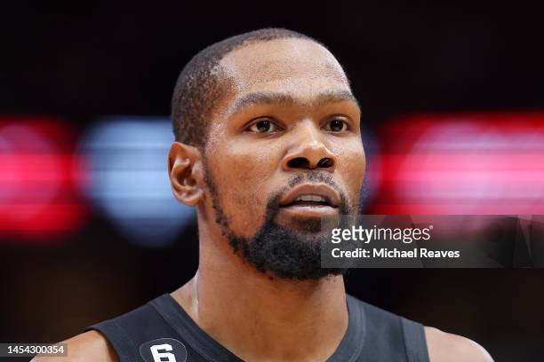 Kevin Durant of the Brooklyn Nets looks on against the Chicago Bulls during the second half at United Center on January 04, 2023 in Chicago,...