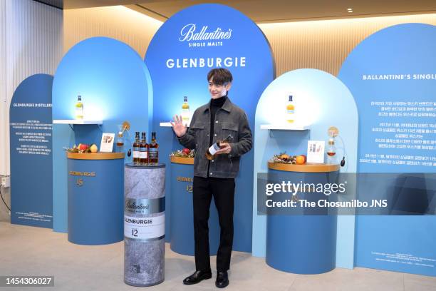 South korean singer Minho of SHINee attends the photocall for Ballantine's Single Malt Glenburgie Station Opening at Gourmet 494 on December 21, 2022...