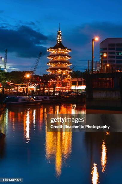 scenic tua pek kong chinese temple with reflections in the rajang river at dusk in sibu, sarawak, malaysia - sibu river stock pictures, royalty-free photos & images