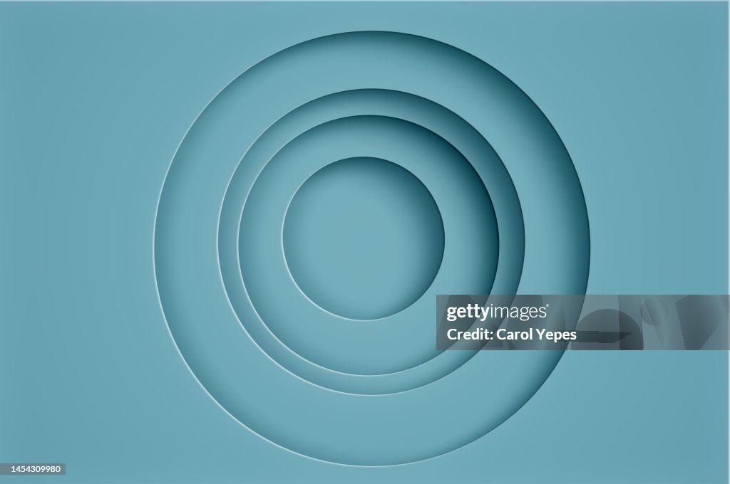 Abstract natural cut shapes circles paper background in blue