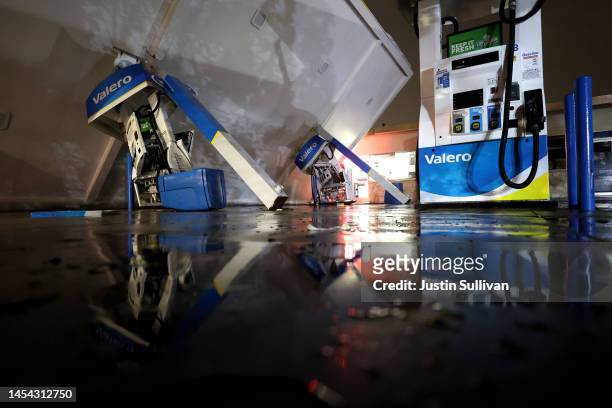 Gas pumps are crushed by the canopy at a Valero gas station that was toppled by high winds on January 04, 2023 in South San Francisco, California....
