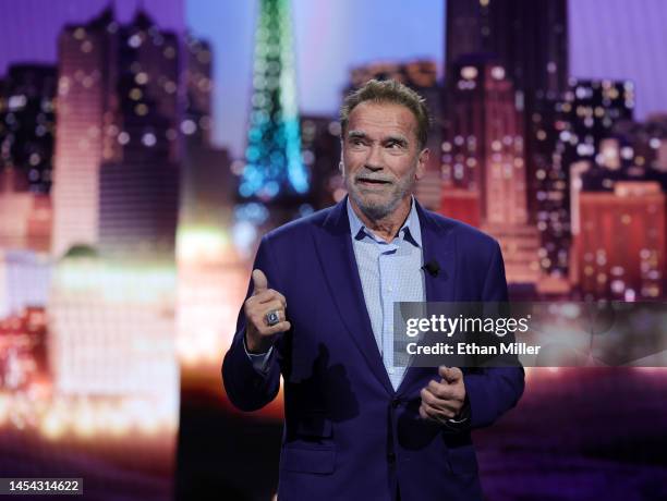 Actor Arnold Schwarzenegger speaks during a keynote address by Chairman of the Board of Management of BMW AG Oliver Zipse at CES 2023 at The Pearl...