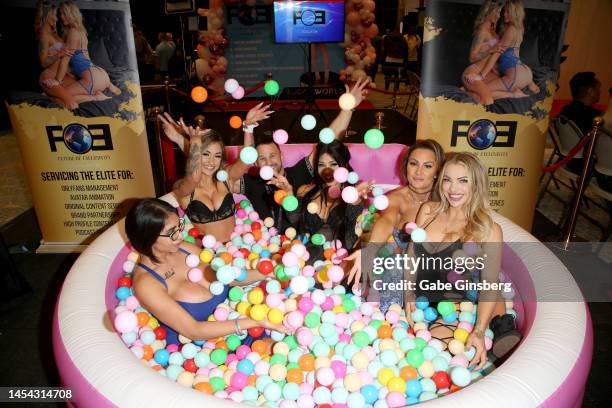 Future of Exclusivity founder and CEO Josh Heffler poses in a ball pit with adult film actresses Mariza Lamb, Autumn Marie, Bronze Goddess, Swedish...