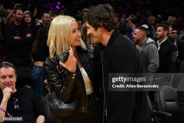 Ashley Benson and Brandon Davis attend a basketball game between the Los Angeles Lakers and the Miami Heat at Crypto.com Arena on January 04, 2023 in...