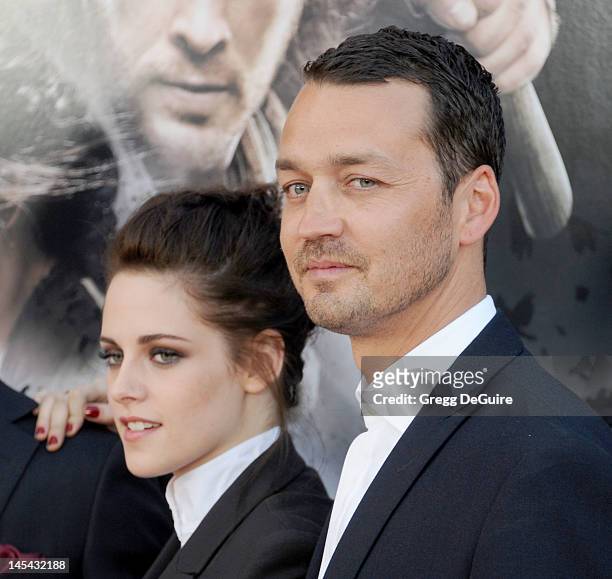 Actress Kristen Stewart and director Rupert Sanders arrive at "Snow White And The Huntsman" Los Angeles screening at Westwood Village on May 29, 2012...