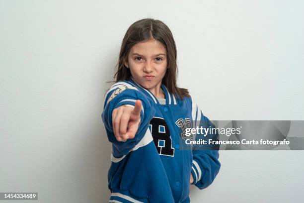 girl point finger to camera - girl pointing bildbanksfoton och bilder